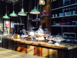 Lots of cakes and fresh baked goods displayed in the café.