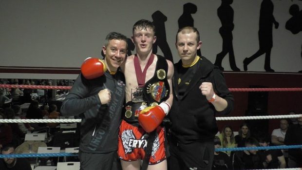 Jamie and his coaches celebrating his dramatic win.